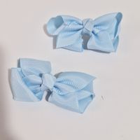 Par de ganchos celestes para el cabello para niñas Aititi´s Kids