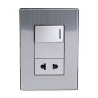 Placa Armada Orange: Interruptor + Tomacorriente Acero Inoxidable
