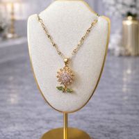 Collar Girasol Giratorio Dorado con Zircones